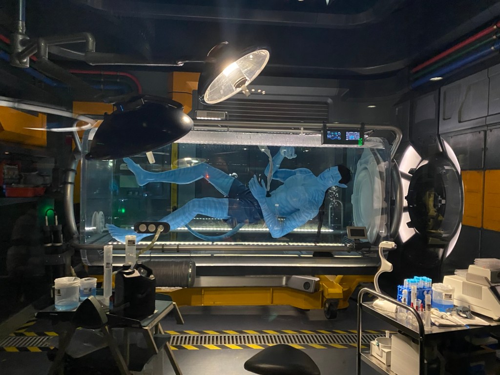 A Na'vi in sleep pod, found within the queue for Pandora Flight of Passage at Pandora - The World of Avatar, Disney's Animal Kingdom Theme Park